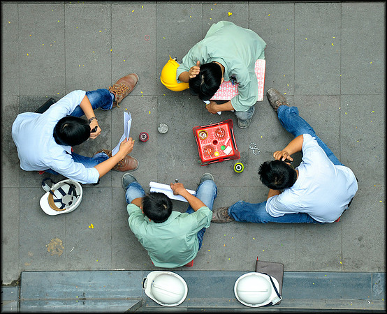 Construction workers take a break on Dong Koi Street