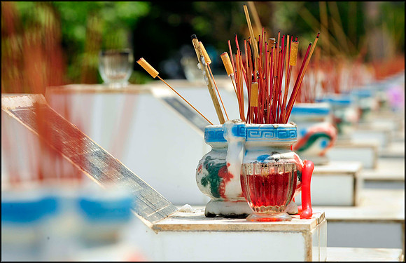 War Cemetary Joss Sticks and Cigarette Butts