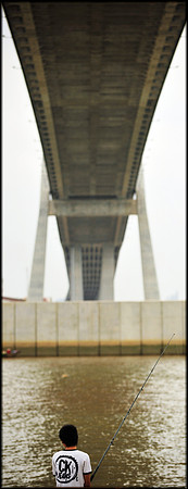 Fishing under Phu My Hung Bridge