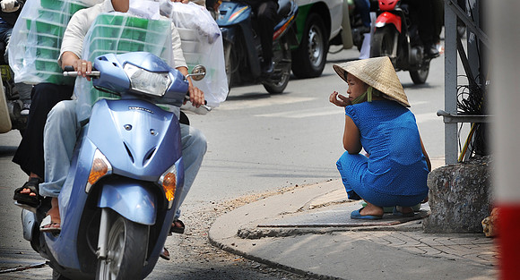 Shopkeeper Watching Traffic